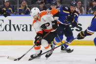 Philadelphia Flyers center Claude Giroux (28) controls the puck against St. Louis Blues center Ryan O'Reilly (90) during the first period of an NHL hockey game Wednesday, Jan. 15, 2020 in St. Louis. (AP Photo/Dilip Vishwanat)