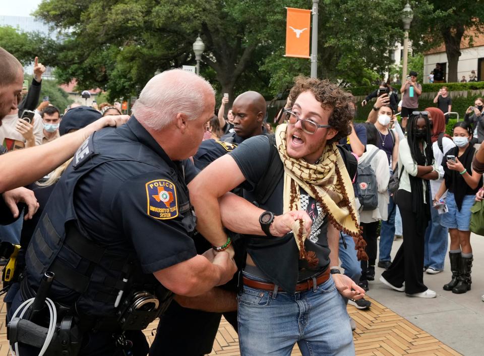 University of Texas police officers arrest UT student Ammer Qaddumi at a pro-Palestinian protest at UT Wednesday April 24, 2024.