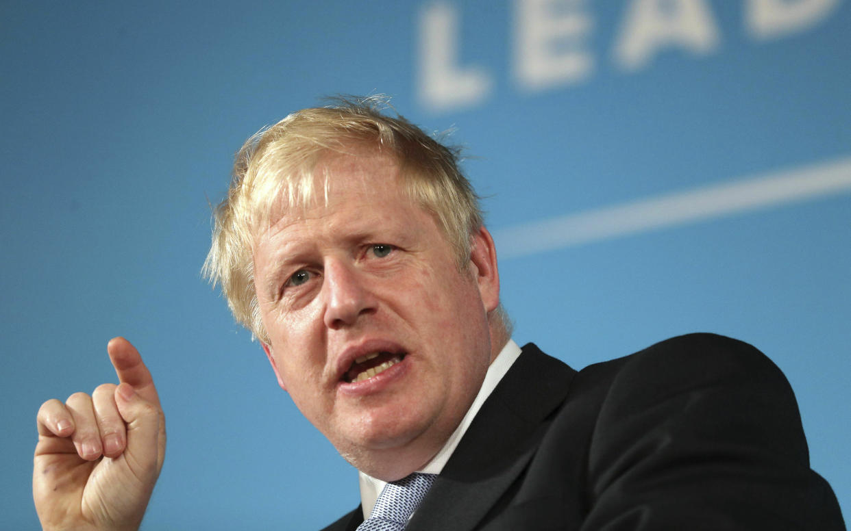 Conservative party leadership contender Boris Johnson speaks at Bournemouth Pavilion Theatre, south England, Thursday June 27, 2019. The winner of the leadership contest will replace Theresa May, who stepped down as party leader after failing to secure Parliament's approval for her Brexit deal. (Andrew Matthews/PA via AP)