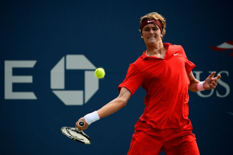 Germany's Alexander Zverev returns a shot against Germany's Philipp Kohlschreiber during their US Open match at the USTA Billie Jean King National Tennis Center on September 1, 2015