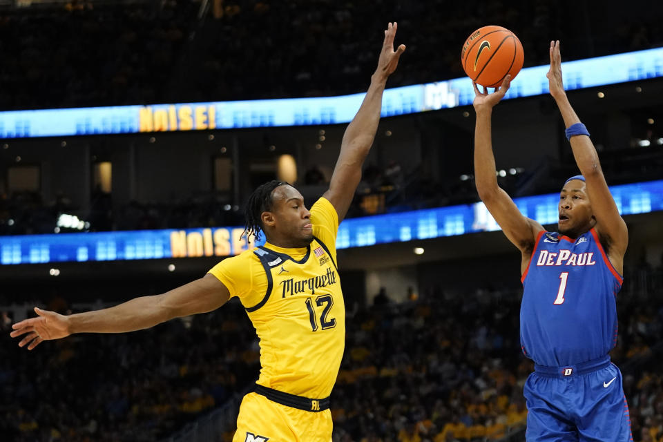 DePaul's Javan Johnson (1) shoots against Marquette's Olivier-Maxence Prosper during the second half of an NCAA college basketball game Saturday, Feb. 25, 2023, in Milwaukee. (AP Photo/Aaron Gash)