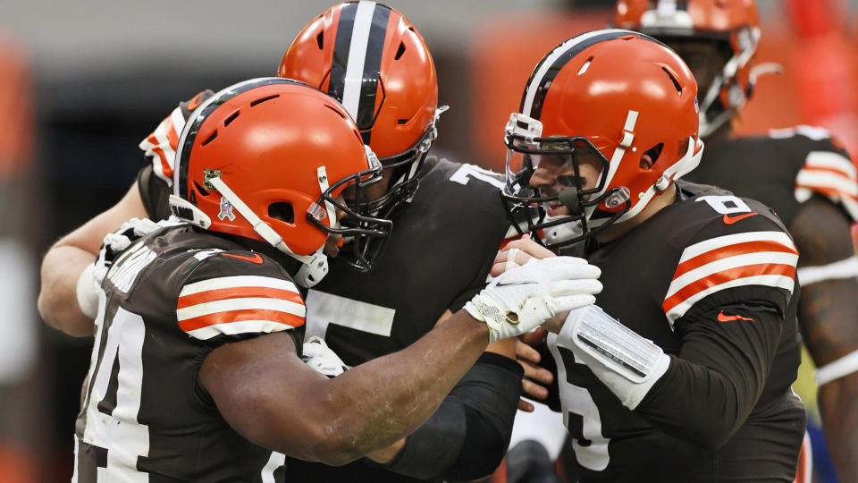 Cleveland Browns quarterback Baker Mayfield, right, congratulates running back Nick Chubb, left, after Chubb rushed for a 9-yard touchdown during the second half of an NFL football game against the Houston Texans, Sunday, Nov. 15, 2020, in Cleveland. (AP Photo/Ron Schwane)