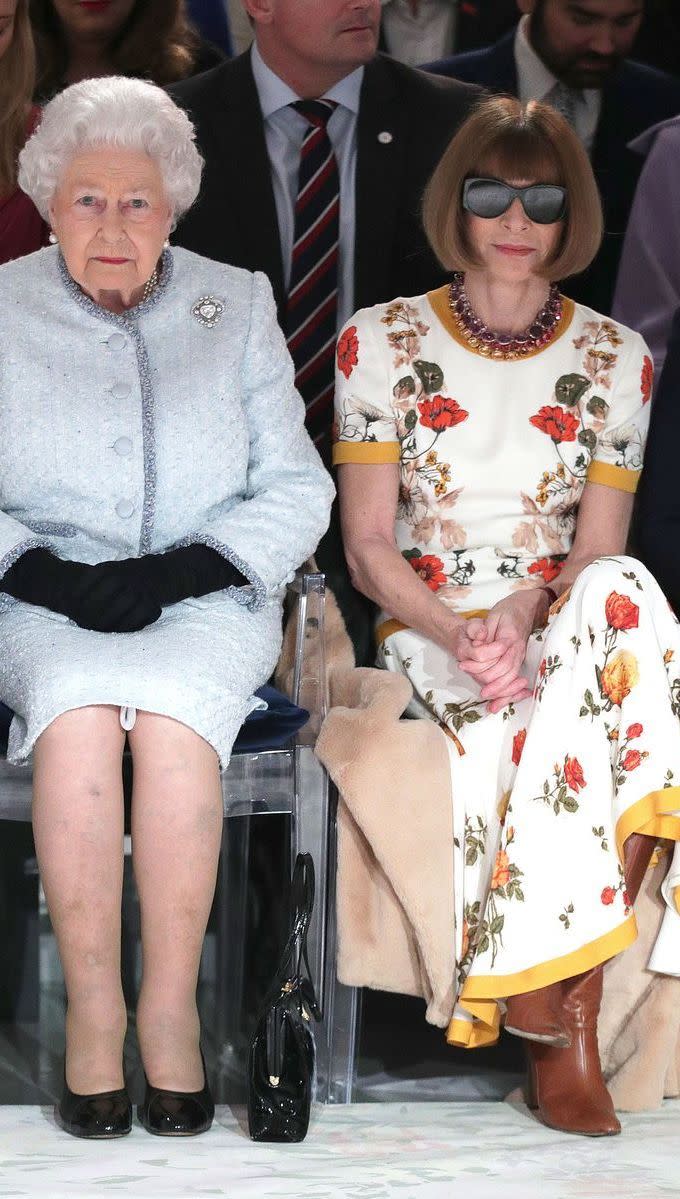 <p>Name a more iconic duo, truly I’ll wait. The outfit Anna Wintour wore to sit next to the Queen is the only one you need to see—from her caramel leather boots to her dark sunglasses, it’s all perfection.</p>