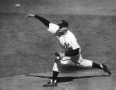 FILE - In this Oct. 8, 1956, file photo, New York Yankees' Don Larsen delivers a pitch in the fourth inning of Game 5 against the Brooklyn Dodgers in the baseball World Series en route to the first World Series perfect game. The Yankees won 2-0 and went on to win the series. Larsen, the journeyman pitcher who reached the heights of baseball glory in 1956 for the Yankees when he threw a perfect game and the only no-hitter in World Series history, died Wednesday night, Jan. 1, 2020. He was 90. (AP Photo, File)