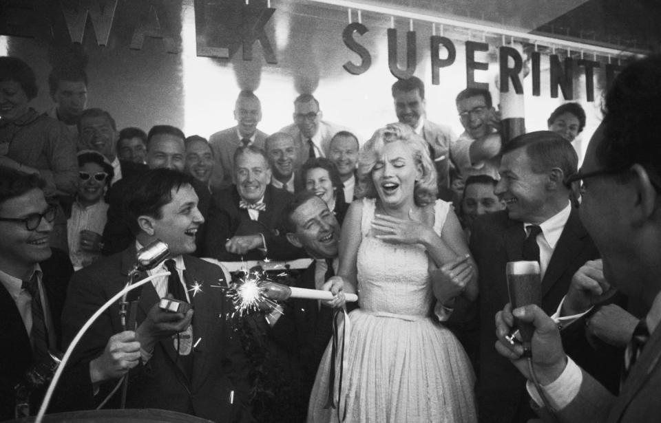 Marilyn Monroe ignites a firecracker: 1957