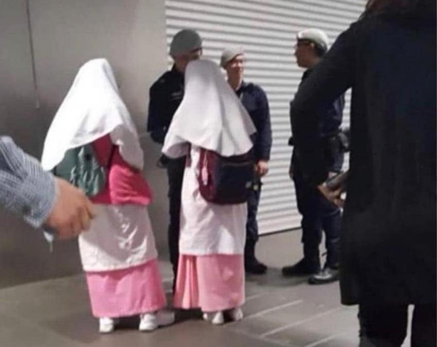 The Singapore police clarified that TransCom officers seen in a recent photo had approached the two Madrasah students to invite them to sign up for the Riders-On-Watch volunteer scheme. (PHOTO: Irwan Hadi/Facebook)