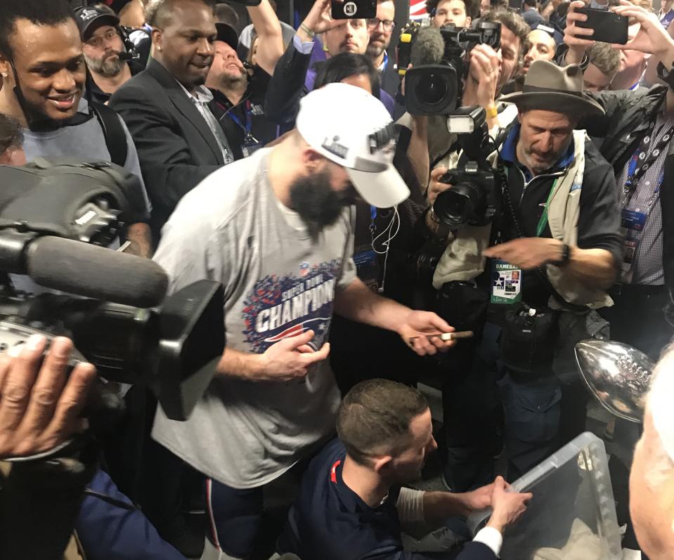 Julian Edelman was one of the few to take a cigar from Robert Kraft. (Yahoo Sports)