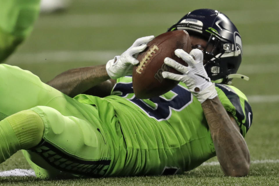 Seattle Seahawks free safety Tedric Thompson eyes the ball after he intercepted a Los Angeles Rams pass during the second half of an NFL football game Thursday, Oct. 3, 2019, in Seattle. (AP Photo/Stephen Brashear)