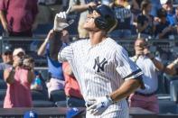 Sep 25, 2017; Bronx, NY, USA; New York Yankees right fielder Aaron Judge (99) gestures after hitting his record breaking 50th home run against the Kansas City Royals during the seventh inning of the game at Yankee Stadium. Mandatory Credit: Gregory J. Fisher-USA TODAY Sports