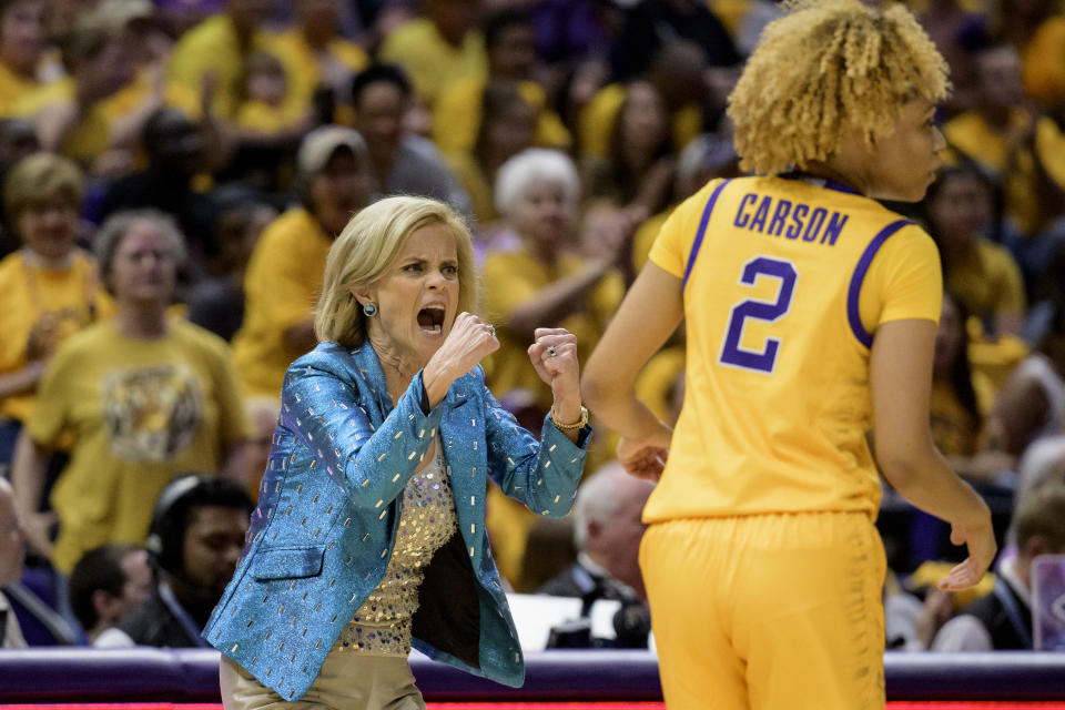 LSU head coach Kim Mulkey, left, reacts next to LSU guard Jasmine Carson (2) in the first half of an NCAA college basketball game against Mississippi State, Sunday, Feb. 26, 2023, in Baton Rouge, La. (AP Photo/Matthew Hinton)