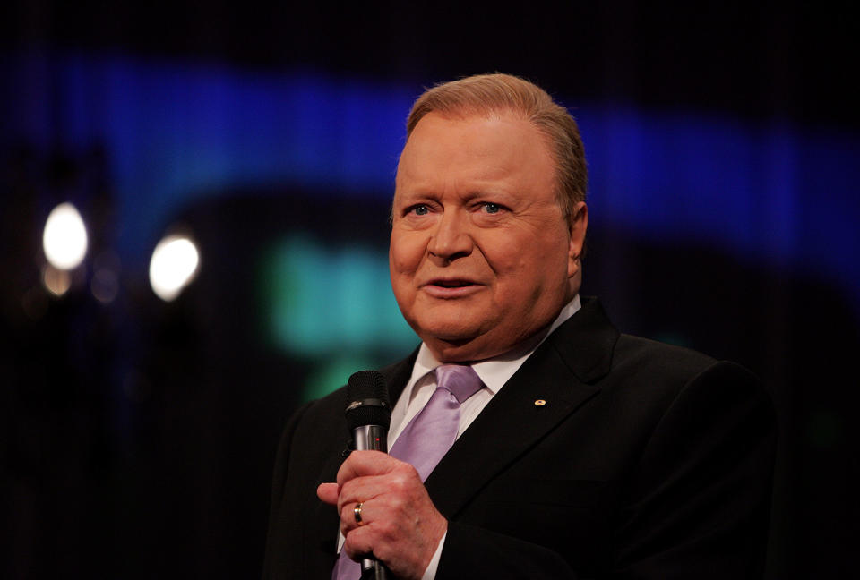 TV personality Bert Newton talks live during the production of 