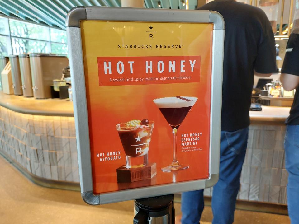 A board at the Starbucks Reserve Roastery in Chicago advertising two hot honey drinks - an affogato and an espresso martini
