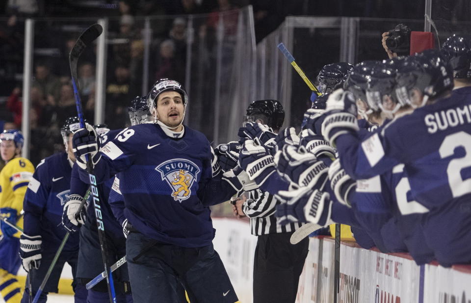 Finland's Niko Huuhtanen celebrates a goal during the third period of a quarterfinal hockey match against Sweden at the world junior championship in Moncton, New Brunswick, Monday, Jan. 2, 2023. (Ron Ward/The Canadian Press via AP)