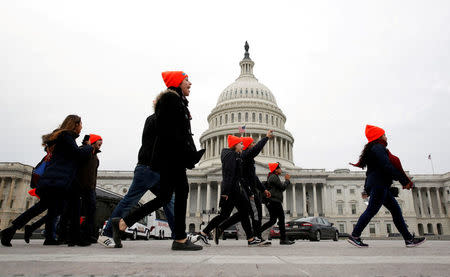 FILE PHOTO: Protesters who call for an immigration bill addressing the so-called Dreamers, young adults who were brought to the United States as children, rally on Capitol Hill in Washington, DC, U.S., December 20, 2017. REUTERS/Joshua Roberts/File Photo