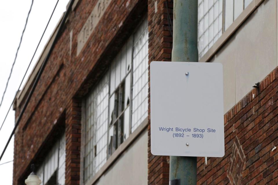 A sign notes the site of the Wright brothers' first bicycle shop outside the former Gem City Ice Cream building in Dayton, Ohio. The Dayton Board of Zoning Appeals has approved the city’s request to demolish a 129-year-old historic building.