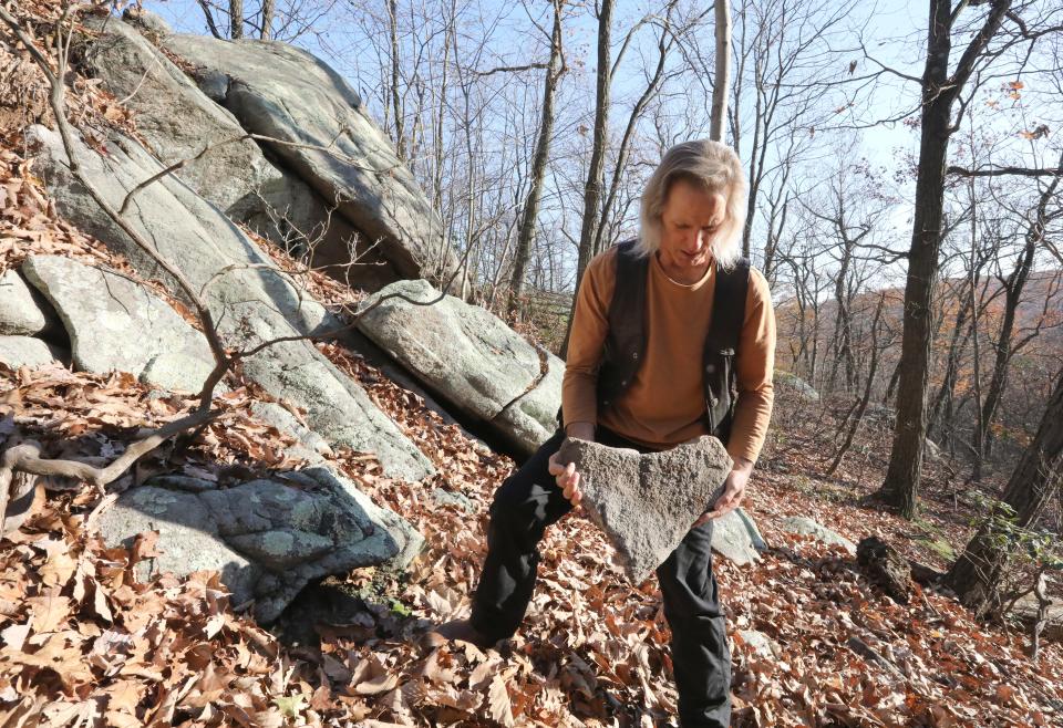 Ernest VanDenHeuvel holds a heart shaped rock he found near the area where the body of Joan D'Alessandro was found in Harriman Park Nov. 16, 2023.