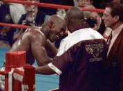 <p>Evander Holyfield reacts after he was bit in the ear by Mike Tyson in the third round of their WBA Heavyweight match Saturday, June 28, 1997, at the MGM Grand in Las Vegas. (AP Photo/Jack Smith) </p>