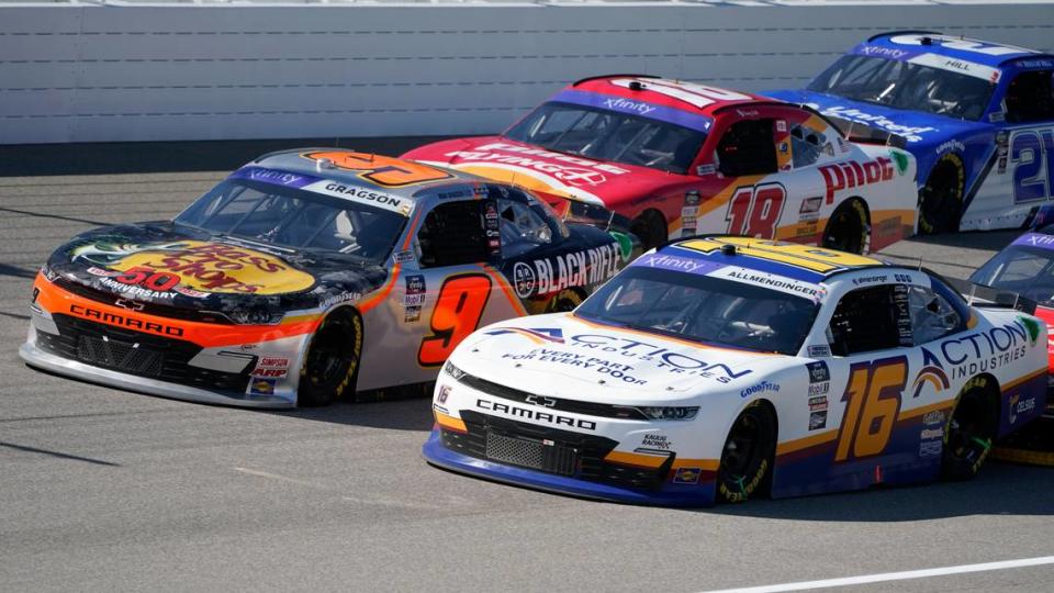 Noah Gragson (9), AJ Allmendinger (16) and Sammy Smith (18) race during the New Holland 250 NASCAR Xfinity Series auto race at the Michigan International Speedway in Brooklyn, Mich., Saturday, Aug. 6, 2022. (AP Photo/Paul Sancya) Paul Sancya/AP