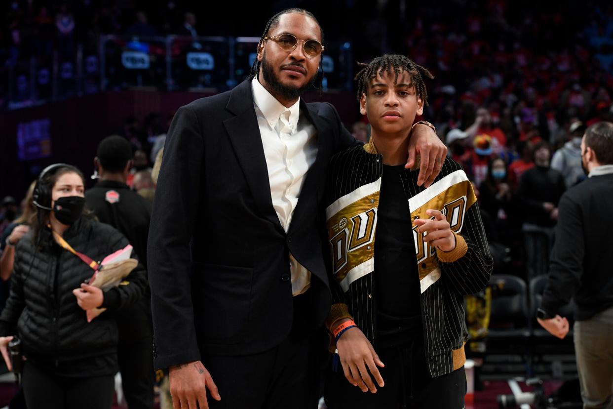 NBA Legend, Carmelo Anthony poses with his son, Kiyan Carmelo Anthony during the 71st NBA All-Star Game as part of 2022 NBA All Star Weekend on February 20, 2022 at Wolstein Center in Cleveland, Ohio.