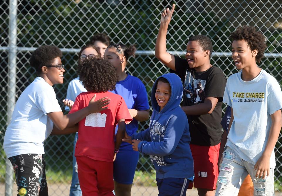 Kids play kickball during the National Night Out event on Aug. 3, 2021 at Wallace Park in Erie.