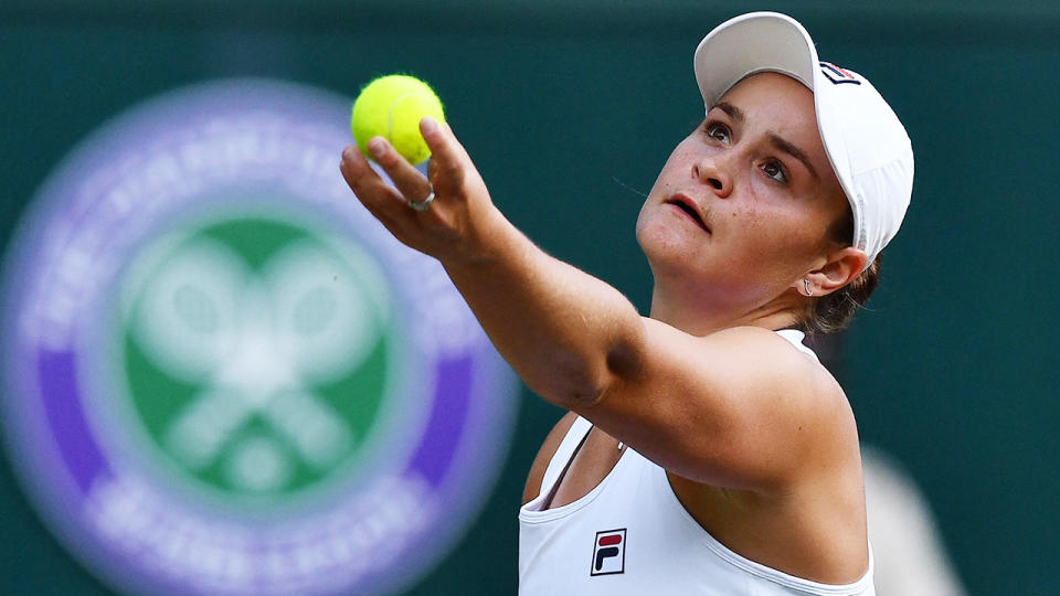 Ash Barty concentrates as she prepares to serve during at match at the 2021 Wimbledon tournament.