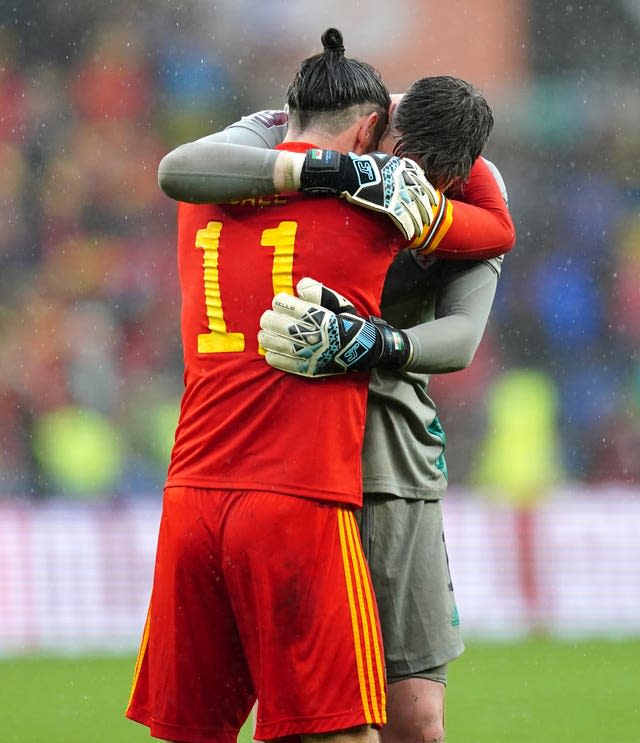 Gareth Bale (left) and goalkeeper Wayne Hennessey celebrate after Wales qualified for the Qatar World (David Davies/PA)