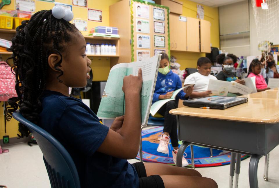 A third-grade student reads to the rest of her class at Beecher Hills Elementary School on Friday, Aug. 19, 2022, in Atlanta, Georgia.