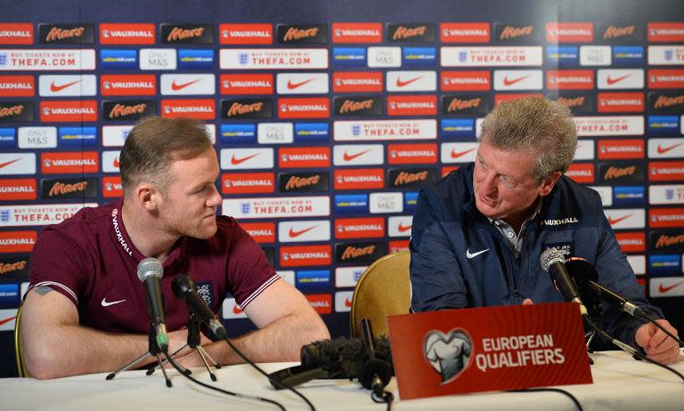 England manager Roy Hodgson (R) and striker Wayne Rooney give a press conference in London on March 26, 2015