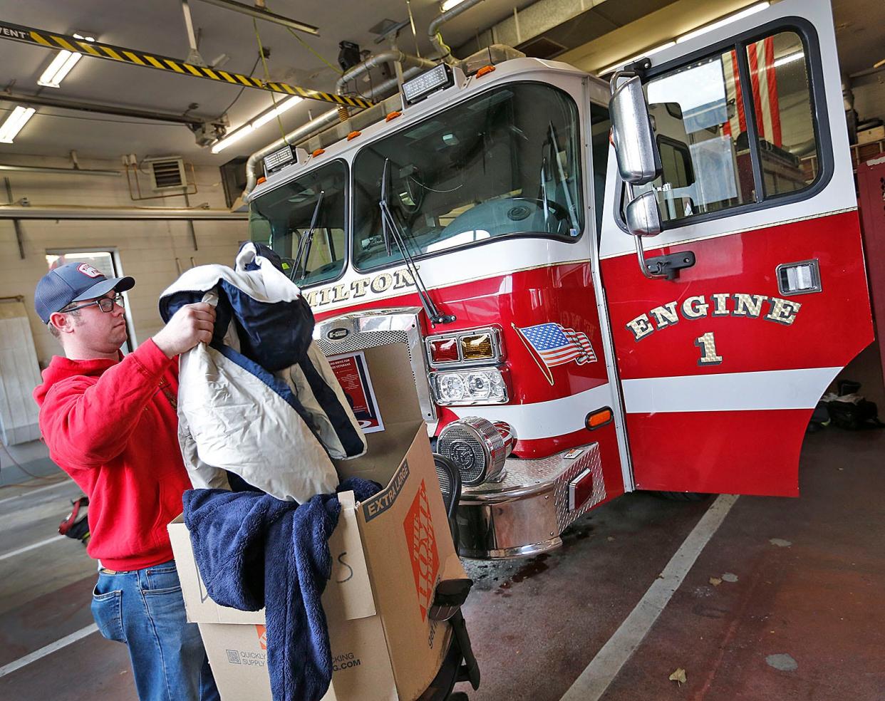 Milton firefighter Matt Clifford, a Marine veteran, gathers donated winter clothing at all three Milton fire stations. The clothes are for homeless veterans.