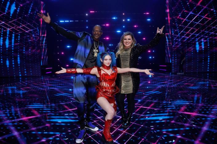 Oklahoma contestant AleXa, center poses with &quot;American Song Contest&quot; hosts Snoop Dogg, left, and Kelly Clarkson on &#x00201c;The Live Grand Final&#x00201d; of the show on May 9. A rising K-Pop star who hails from Jenks, AleXa went on to win on the new NBC show, which is modeled after the long-running Eurovision Song Contest.