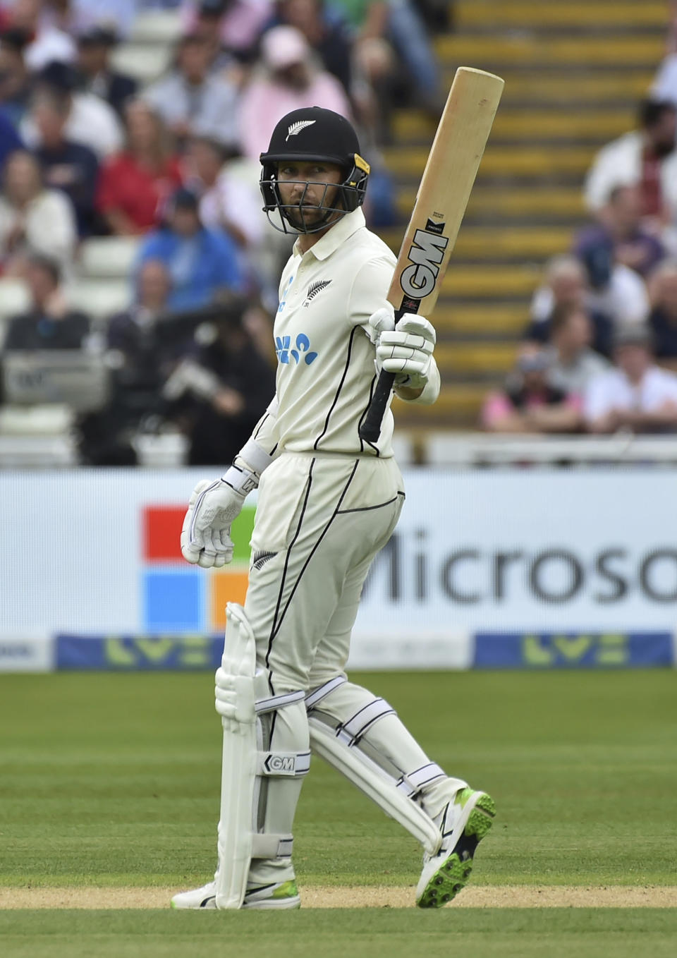 New Zealand's Devon Conway raises his bat to celebrate scoring fifty runs during the second day of the second cricket test match between England and New Zealand at Edgbaston in Birmingham, England, Friday, June 11, 2021. (AP Photo/Rui Vieira)