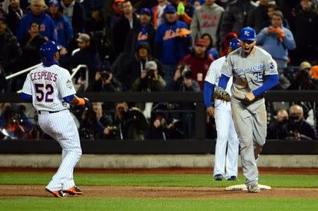 Kansas City Royals first baseman Eric Hosmer (35) celebrates after doubling off New York Mets outfielder Yoenis Cespedes (52) to end game four of the World Series at Citi Field. Jeff Curry-USA TODAY Sports