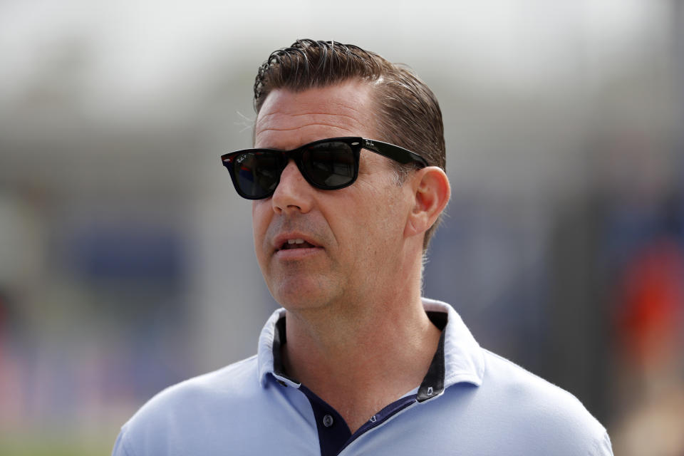 FILE - In this Feb. 15, 2020, file photo, New York Mets general manager Brodie Van Wagenen watches spring training baseball practice in Port St. Lucie, Fla. Van Wagenen and many of his top aides are out, moves announced less than an hour after hedge fund manager Steve Cohen completed his $2.4 billion purchase of the team Friday, Nov. 6, 2020. (AP Photo/Jeff Roberson, File)