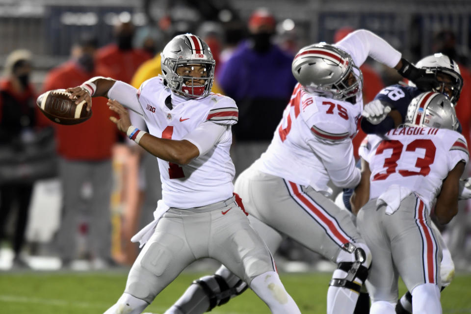 Ohio State quarterback Justin Fields (1) looks for a receiver during the first quarter against Penn State in an NCAA college football game in State College, Pa., Saturday, Oct. 31, 2020. (AP Photo/Barry Reeger)