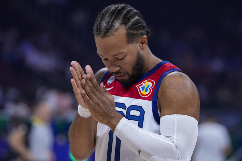 U.S. guard Jalen Brunson (11) pause before the start of the first half of a Basketball World Cup second round match against Montenegro in Manila, Philippines Friday, Aug. 1, 2023. (AP Photo/Michael Conroy)