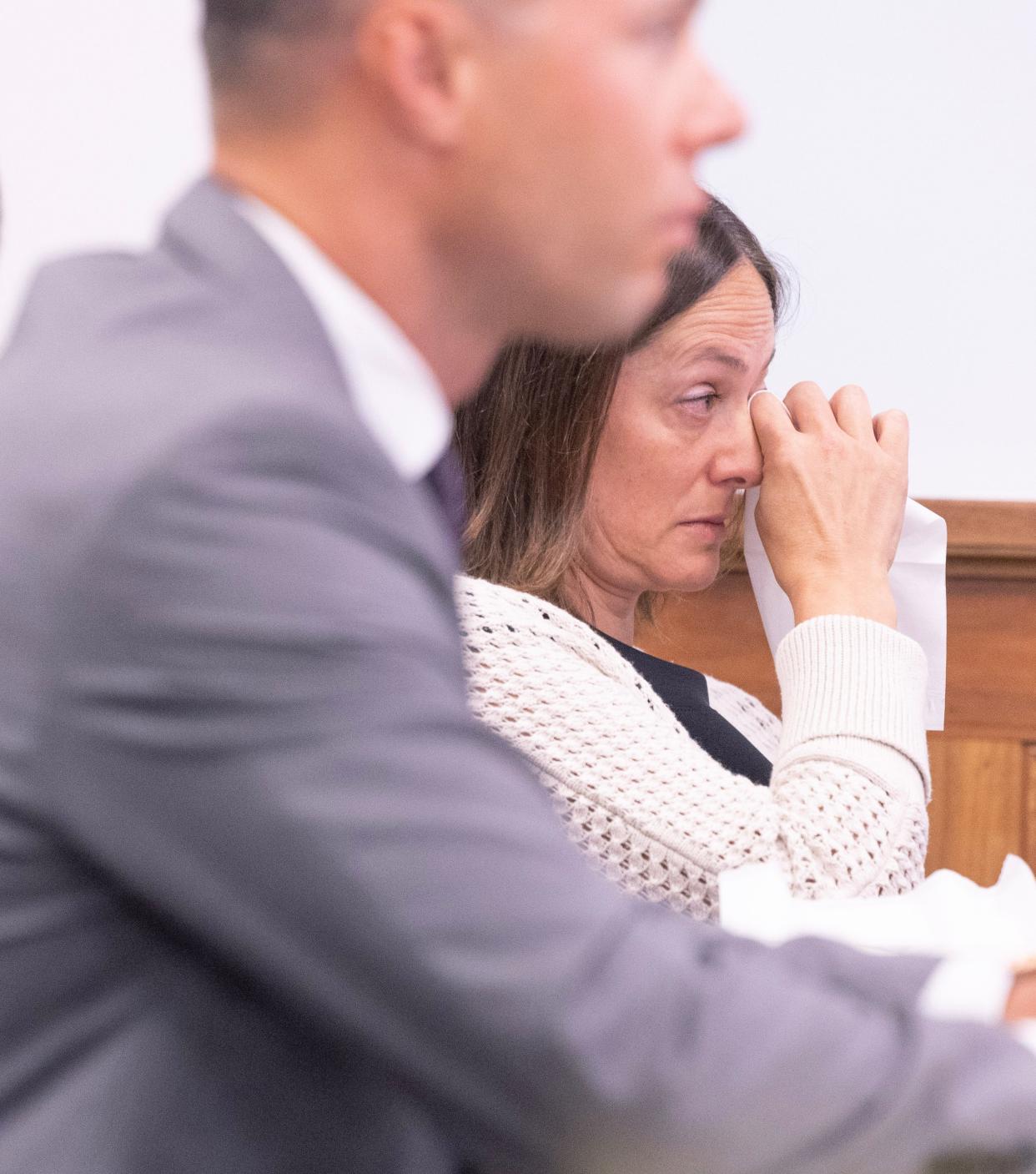 Christi Sinchak, daughter of crash victim Diane Clark, wipes away a tear after speaking Monday in Judge Dixie Park's courtroom in Stark County Probate Court. Park approved a $5 million wrongful death settlement against the Alliance Country Club, on behalf of the families of Charles Neff, David Miller and Diane Clark, who all died in 2021 crash involving a drunken driver.