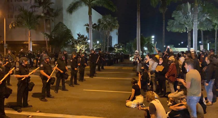 There was a series of standoffs between protesters and police at a rally at South Coast Plaza late Monday night.