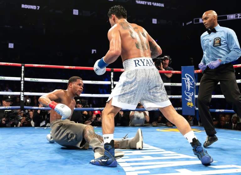 Ryan Garcia (white trunks) flattens Devin Haney during their fight last month in New York (AL BELLO)