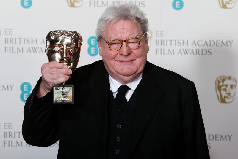 FILE PHOTO: Parker celebrates after receiving Fellowship award at the British Academy of Film and Arts awards ceremony in London