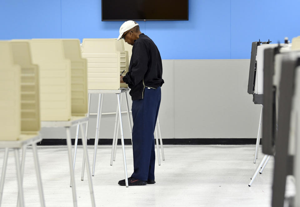Robert Plant, Jr., 70, of Detroit, votes at the Detroit Service Learning Academy in the state's primary election, Tuesday morning, Aug. 3, 2021, in Detroit. (Clarence Tabb Jr./Detroit News via AP)