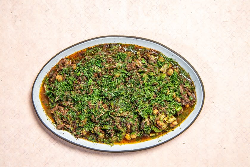 LOS ANGELES, CA - JUNE 19: From the cookbook Falastin, Los Angeles Times restaurant critic Bill Addison makes Sumaqqiyeh: Oxtail stew with chard, sumac, and tahini on Friday, June 19, 2020 in Los Angeles, CA. (Mariah Tauger / Los Angeles Times)