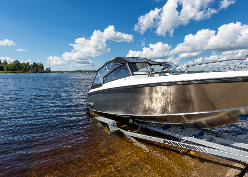 Boat launch on lake water from trailer.