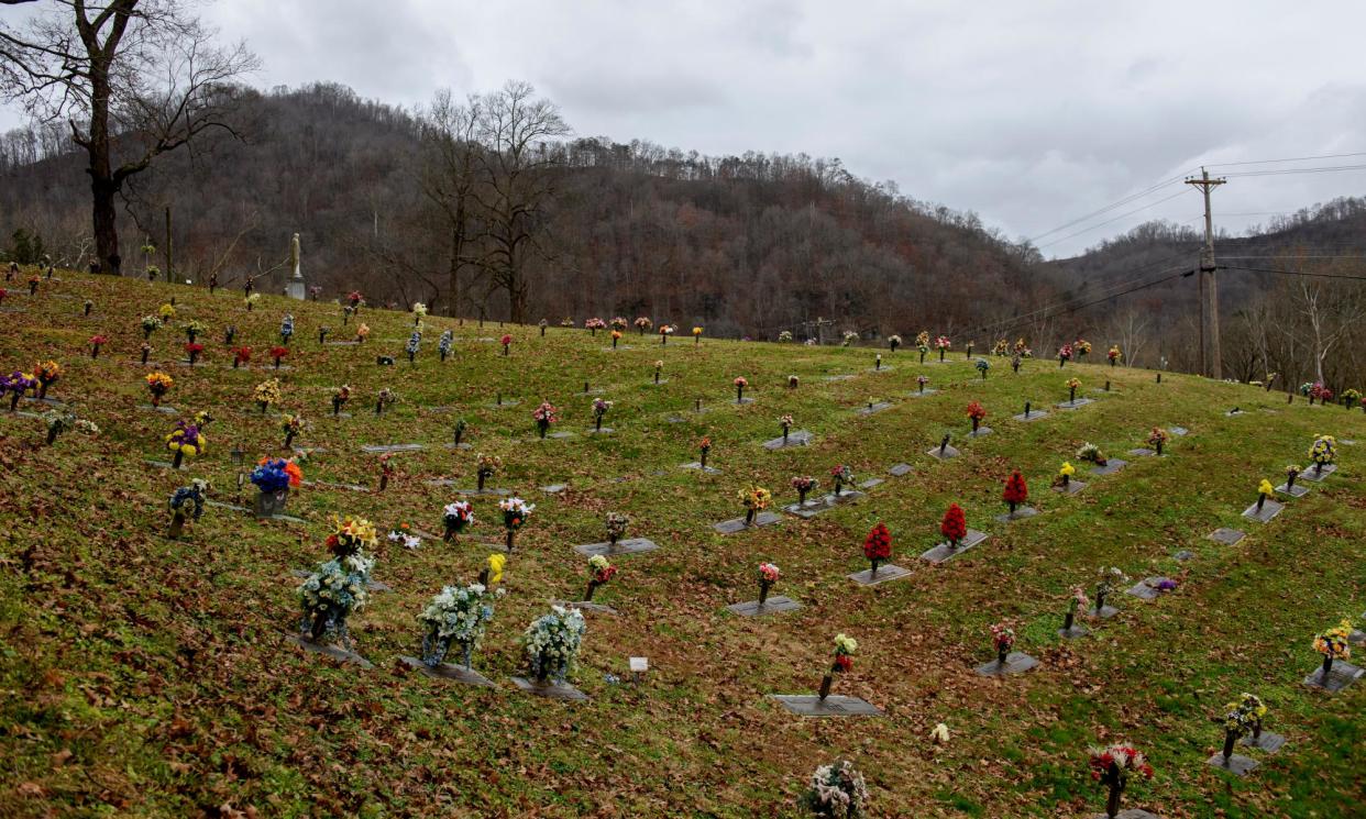 <span>Graves on a hillside in Kentucky.</span><span>Photograph: Jeff Swensen/The Guardian</span>