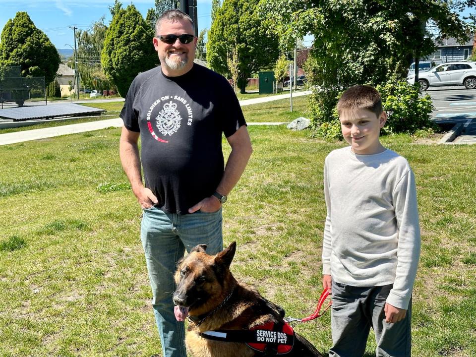 William Toulmin, his son Michael, and Michael's service dog Thor. Photo taken June 6, 2024, in Victoria, B.C. 