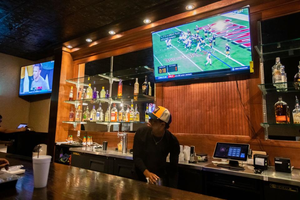 A bartender prepares drinks at Kezzy's Bistro & Bar at Governor's Square Mall on Wednesday, Sept. 28, 2022 in Tallahassee, Fla.