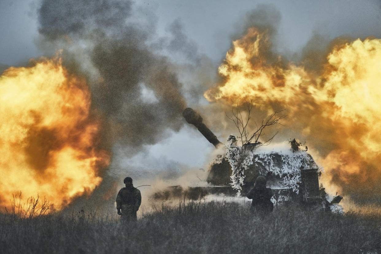 A self-propelled artillery vehicle fires on the frontline, Donetsk region, Ukraine, Saturday, Feb. 18, 2023. (AP Photo/Libkos)