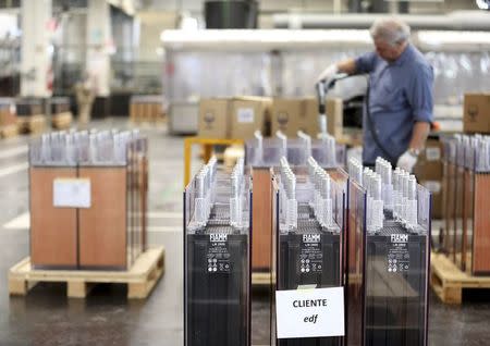 A FIAMM employee prepares batteries for EDF, their French client, in this photo illustration taken at the battery maker's factory in Avezzano, near L'Aquila, November 28, 2014. REUTERS/Alessandro Bianchi