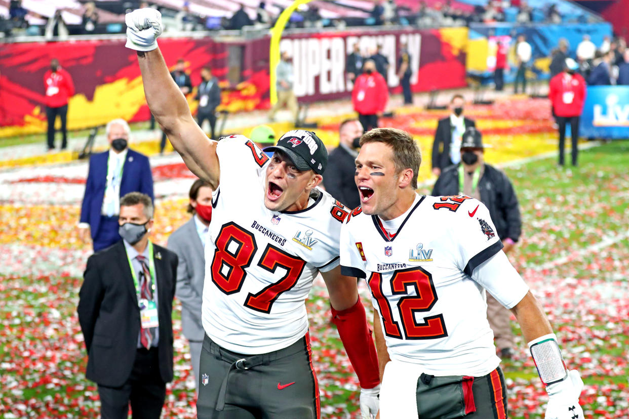 Feb 7, 2021; Tampa, FL, USA;  Tampa Bay Buccaneers quarterback Tom Brady (12) and tight end Rob Gronkowski (87) celebrate after beating the Kansas City Chiefs in Super Bowl LV at Raymond James Stadium.  Mandatory Credit: Mark J. Rebilas-USA TODAY Sports