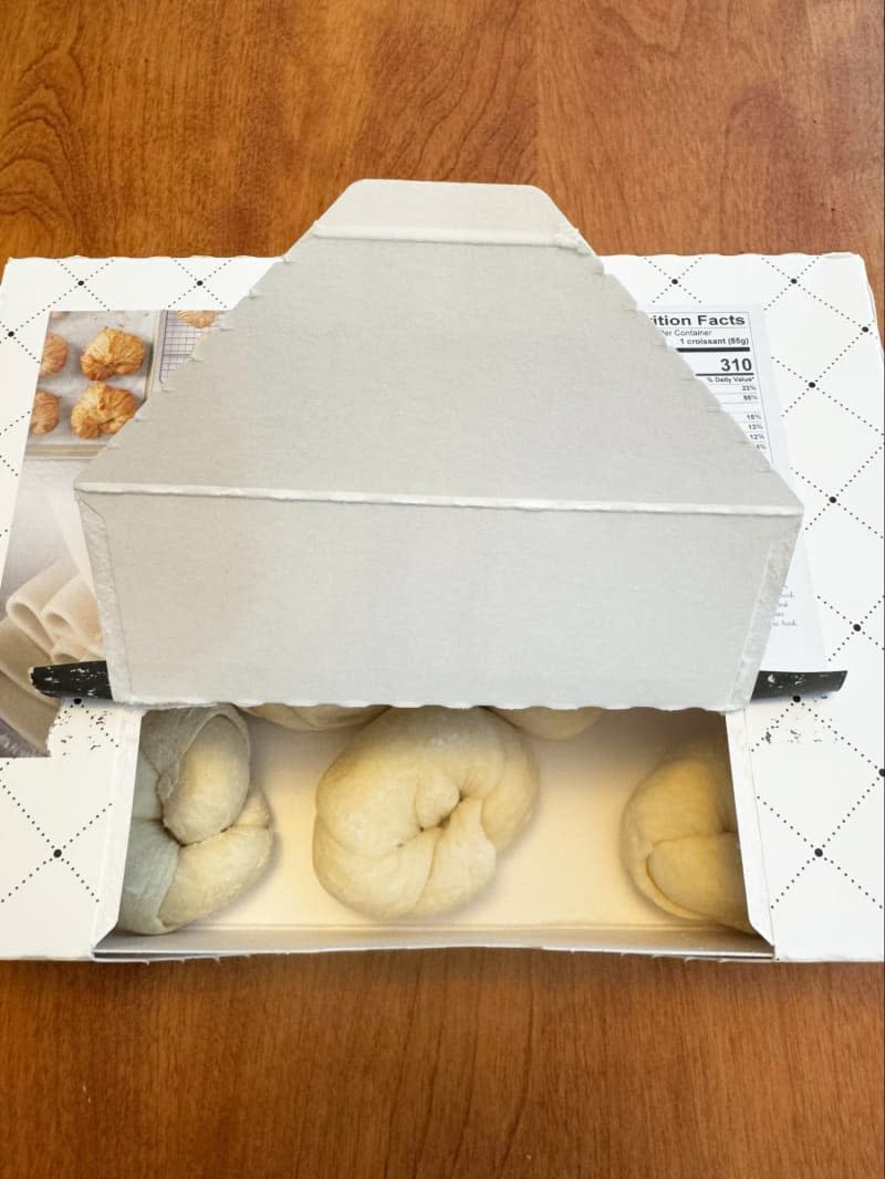 Box of raw shaped croissants