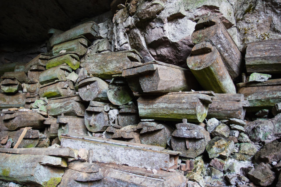 Ancient coffins are seen stacked upon one another at Lumiang Burial Cave, Sagada, Luzon, in the Philippines. 